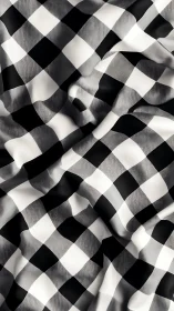 Monochrome gingham textile with soft draped surface modeling.