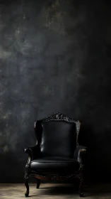 High-back black leather baroque armchair in moody studio