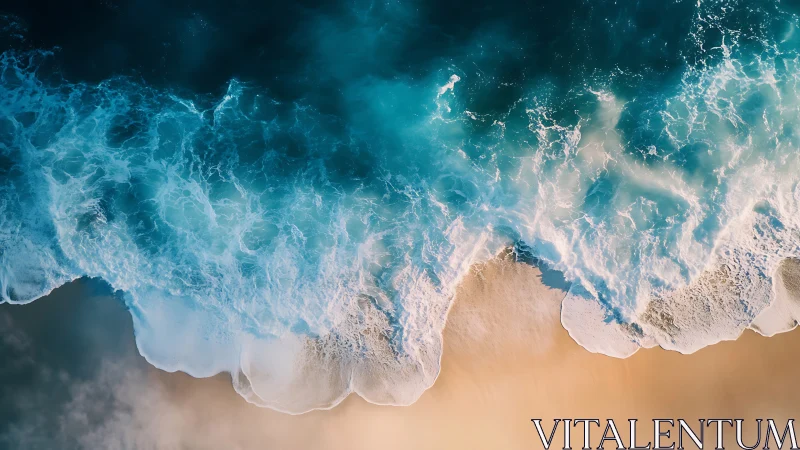 Aerial view of ocean surf meeting smooth sandy shoreline.