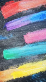 Diagonal multicolor acrylic paint strokes on dark textured board