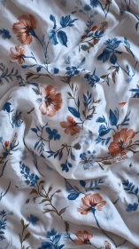 Floral cotton textile with blue and rust botanical print.