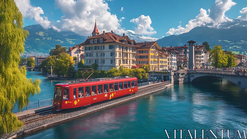 Red riverside tram crosses turquoise canal in alpine town.