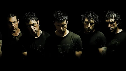 Multiple male figures aligned in low key studio lighting.