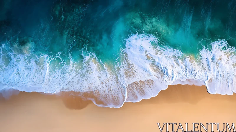Aerial shoreline view with waves on smooth sandy beach.
