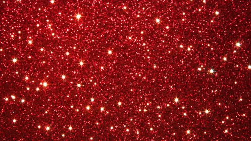 Red glitter background with sparkling bokeh highlights.
