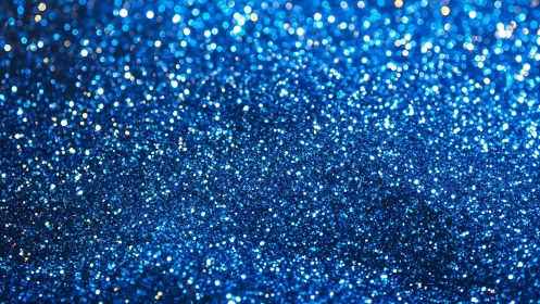 Blue glitter bokeh texture with shimmering light field.