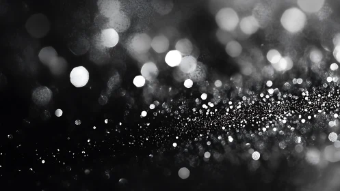 Defocused monochrome light particles in diagonal alignment.