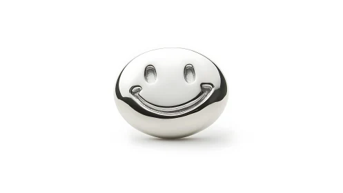 Polished chrome smiley sphere on minimalist white field.