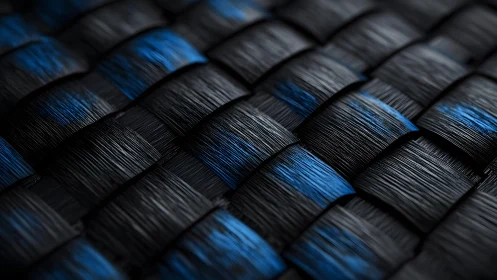 Close-up of black and blue carbon fiber weave, modern abstract style.