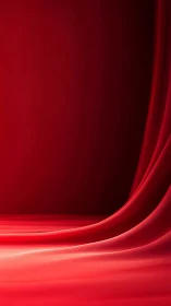 Red fabric backdrop curves across floor and vertical surface