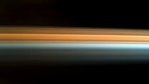 Horizontal motion blur bands form a dual-toned light field