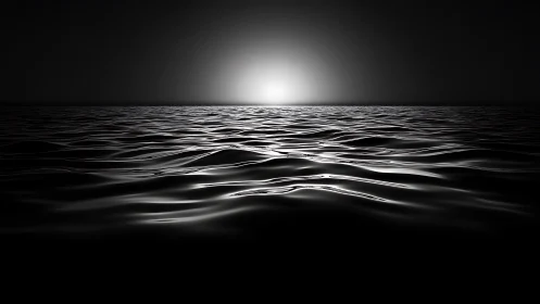 Monochrome seascape captures distant light over dark waves