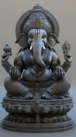 Elephant-headed deity sculpture in seated meditative posture.