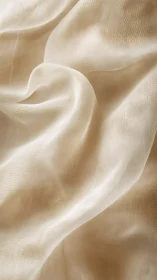 Soft ivory fabric folds form airy, luminous texture study.