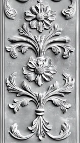 Ornate floral relief sculpture decorates vertical plaster panel