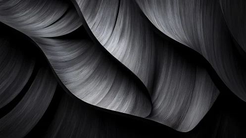Layered metallic ribbons form curved, striated grayscale surfaces