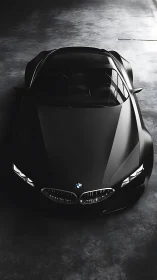 Photorealistic top-view study of a black performance coupe.