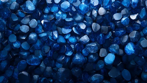 Blue polished stones fill frame under strong diffused lighting
