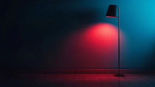 Floor lamp casts red light onto blue wall in dark interior