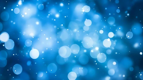 Abstract blue bokeh background with glowing light circles.