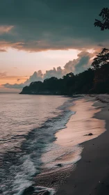 Moody tropical shoreline under dramatic sunset sky.