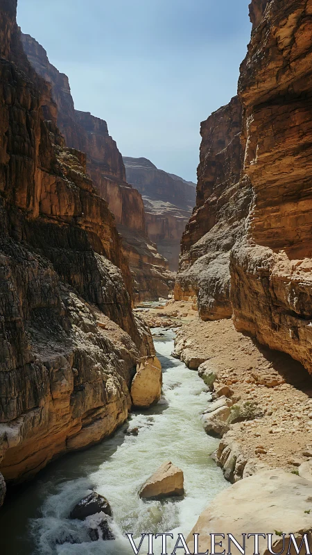 High-walled sandstone canyon with fast whitewater river channel