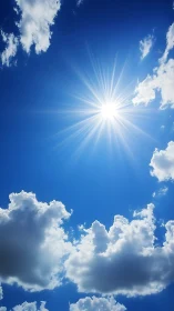 Bright midday sun and cumulus clouds in blue sky.