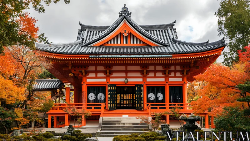 Symmetrical Japanese temple facade in autumnal landscape.