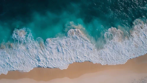 Aerial shoreline photograph captures advancing turquoise surf