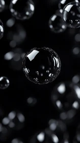 Gleaming soap bubbles drift gently in a soft dark space