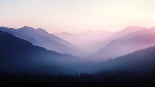 Soft dawn light drapes layered mountain ridges in mist