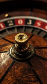 Close-up of roulette wheel spindle and numbered track detail.