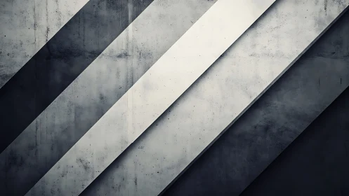 Diagonal concrete panels form layered grayscale geometric structure