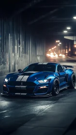 Blue striped sports car parked in dimly lit city tunnel.
