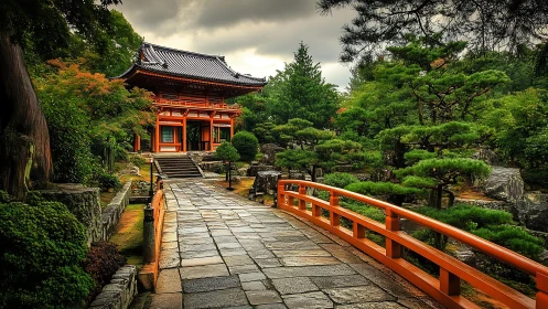 Japanese temple gate and vivid red bridge in tranquil garden.