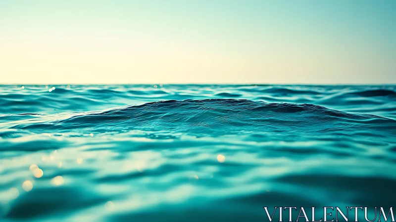 Gentle turquoise waves roll quietly under a soft morning sky