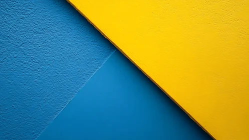 Diagonal duet of bold yellow and textured ocean blue walls.