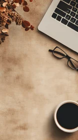 Minimal workspace scene pairs laptop, coffee and glasses