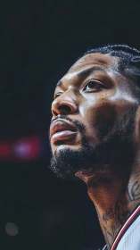 Sweat-lit courtside gladiator gazes toward unseen thunder.