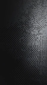 Dark gradient grid of circular perforations on metal panel.