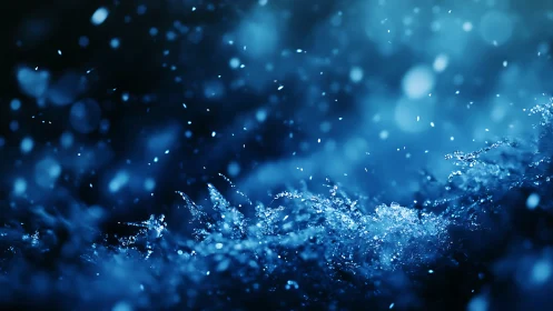 Blue macro view of ice crystals and drifting snowflakes.