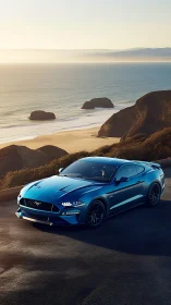 Blue sports coupe is parked on coastal cliffside roadway
