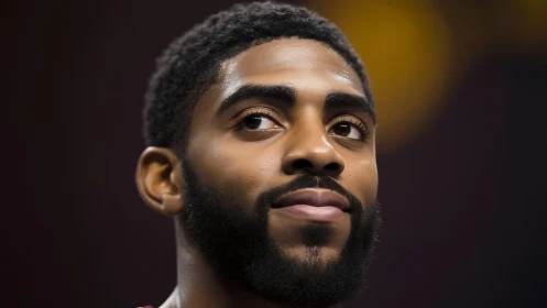 Close-up portrait photograph of a bearded man facing forward