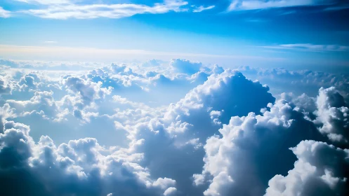 High-altitude cumulus cloudscape under vibrant blue sky.