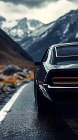 Moody mountain highway cruise with a classic black car.