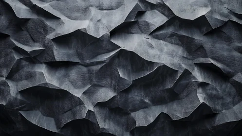 Abstract dark geometric wall with angular textured folds pattern.