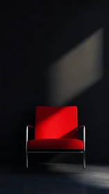 Red armchair under angled light in dark interior.