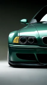 Close-up front view of green sports coupe in studio lighting.