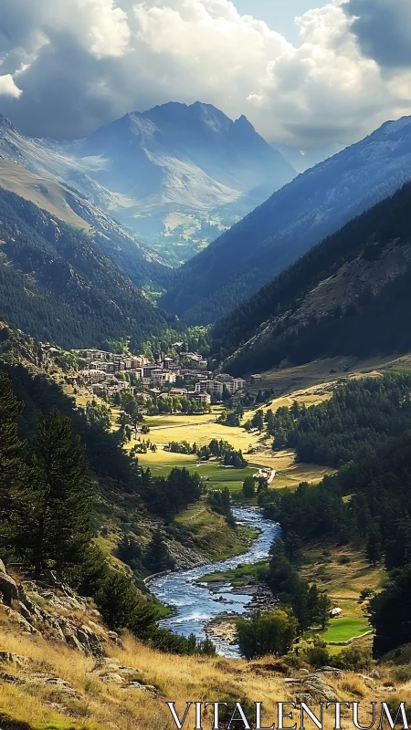 Mountain valley town with river and distant peaks under clouds