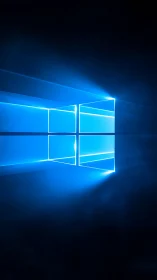 Blue window-shaped light logo on dark gradient background.